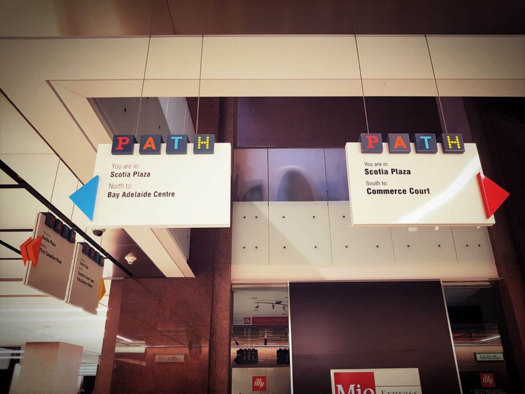 The picture shows maps and color codes that are used to traverse the PATH Toronto